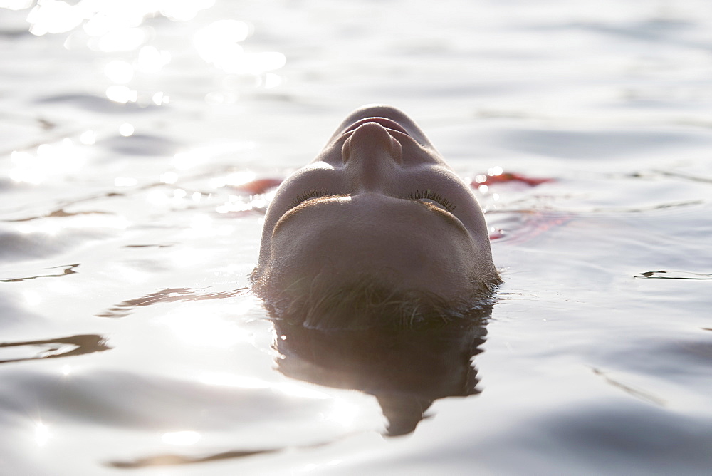 Woman relaxing in lake
