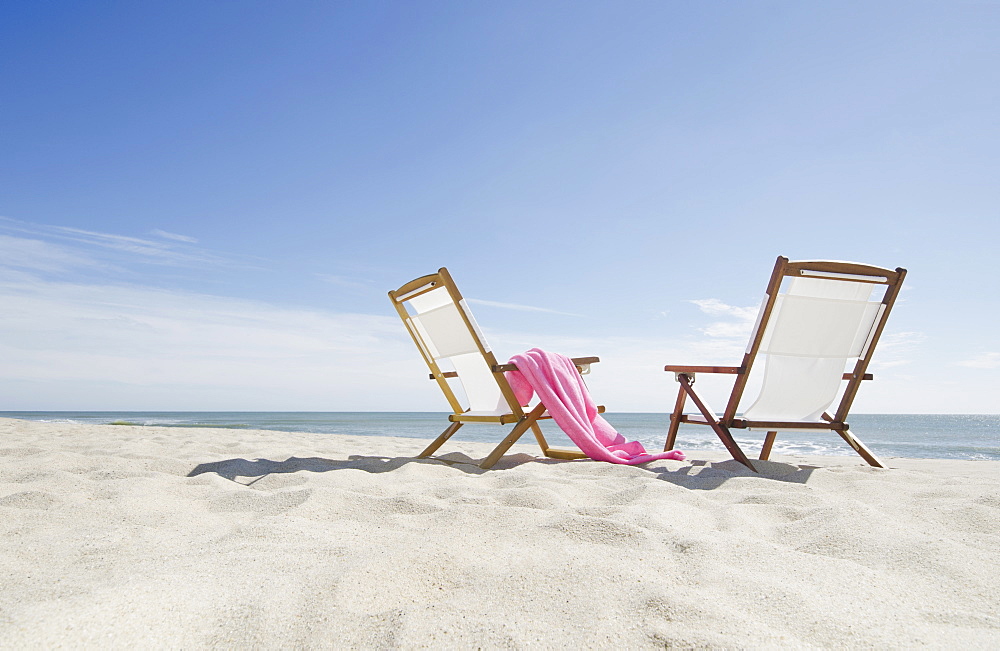 empty lounge chairs on sandy beach, USA, Massachusetts, Nantucket