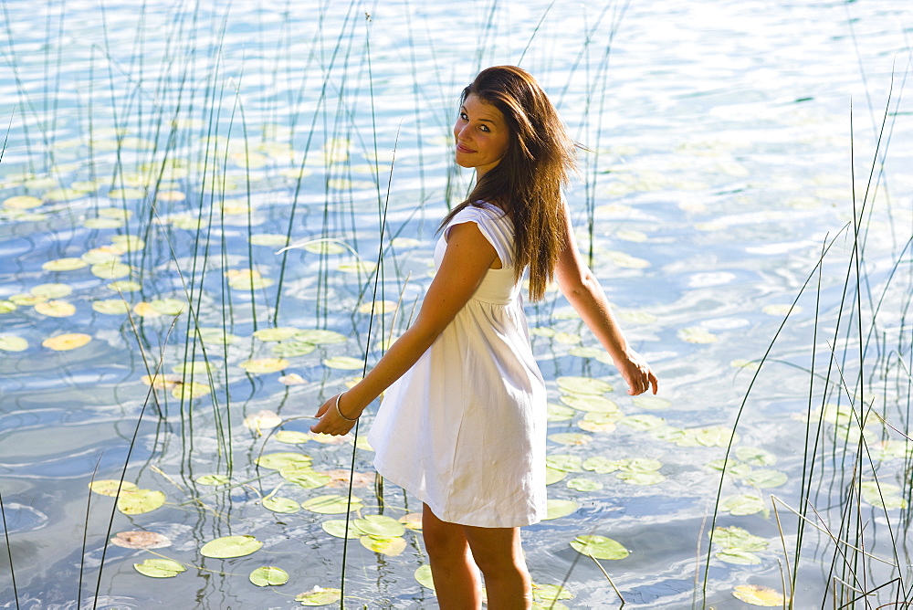 USA, Montana, Portrait of teenage girl (16-17) at lakeside