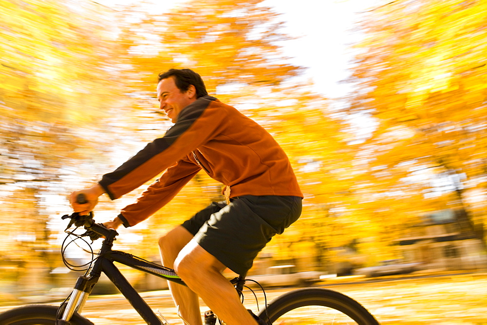 USA, Montana, Kalispell, Mid adult man cycling