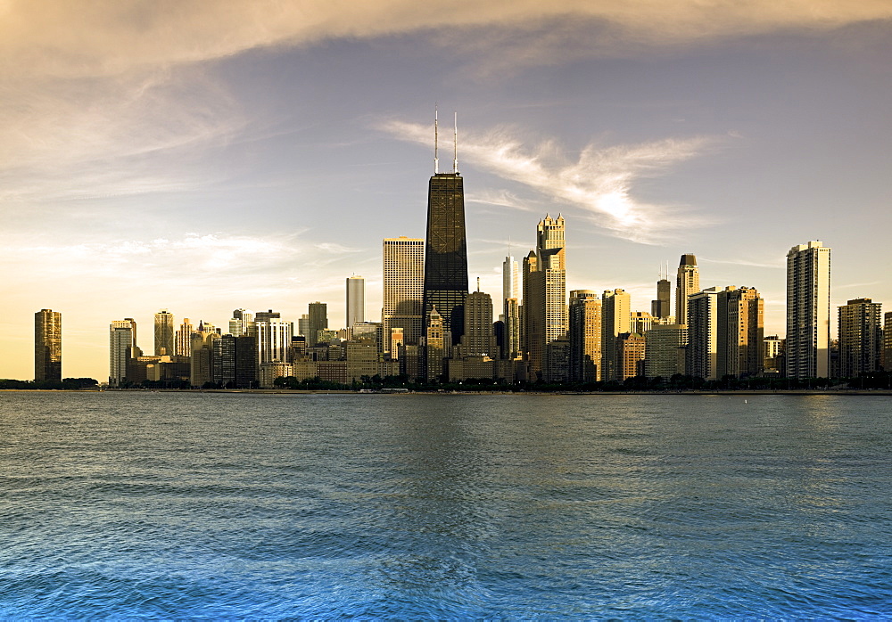 USA, Illinois, Chicago, City skyline over Lake Michigan at sunset