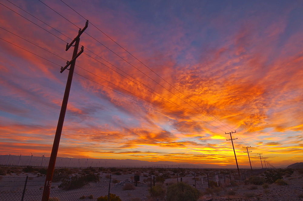 USA, California, Palm Springs, power line at sunrise