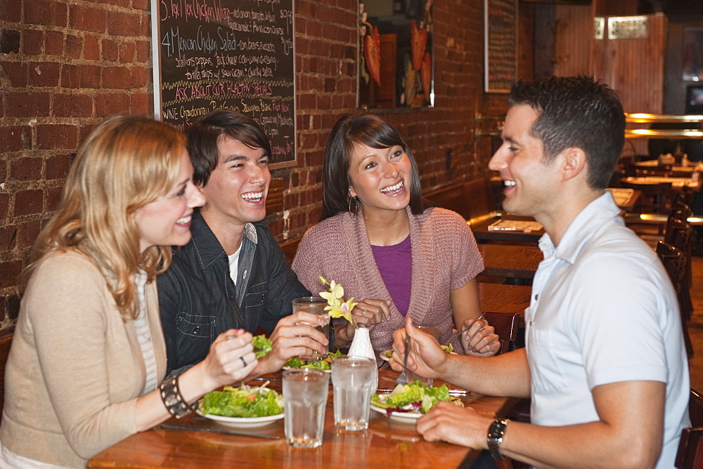 Friends eating at restaurant