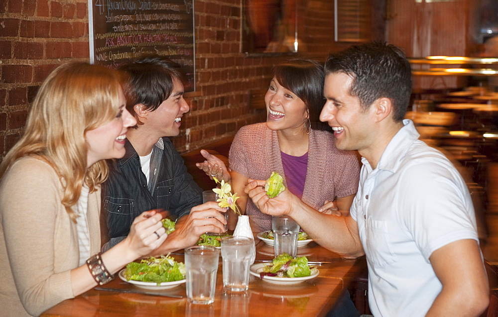 Friends eating at restaurant