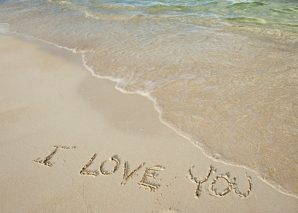 I love you message written in sand