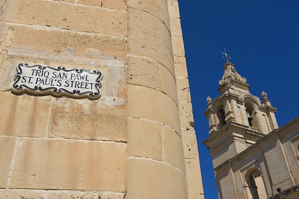 St. Paulâ€™s Street sign and Mdina Cathedral, Malta