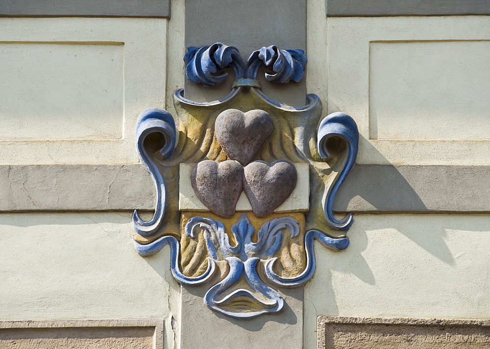 Close up of heart emblem on house