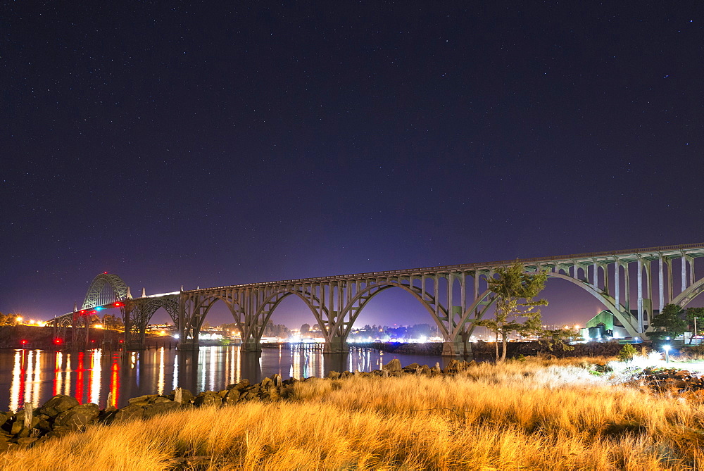 View of arch bridge at night, Newport, Oregon