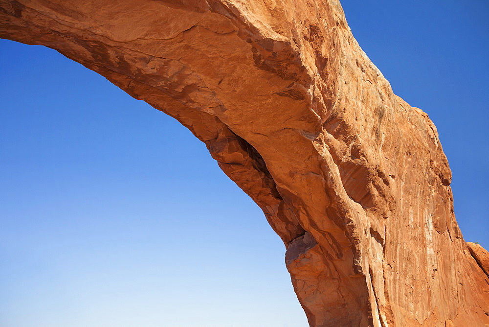 Close up of natural arch against clear blue sky, USA, Utah, Arches National Park, Moab