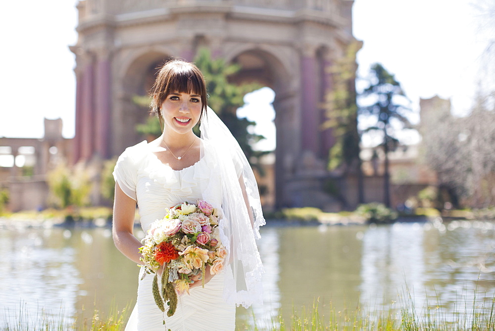 Portrait of young bride in park, San Francisco, California