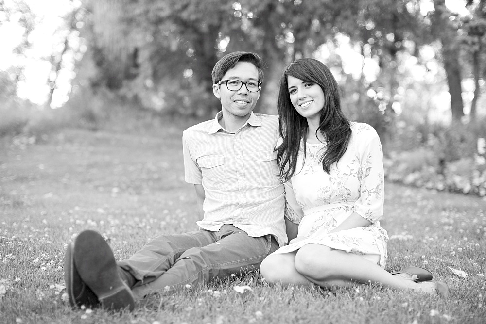 Portrait of couple relaxing in park, Salt Lake City, Utah