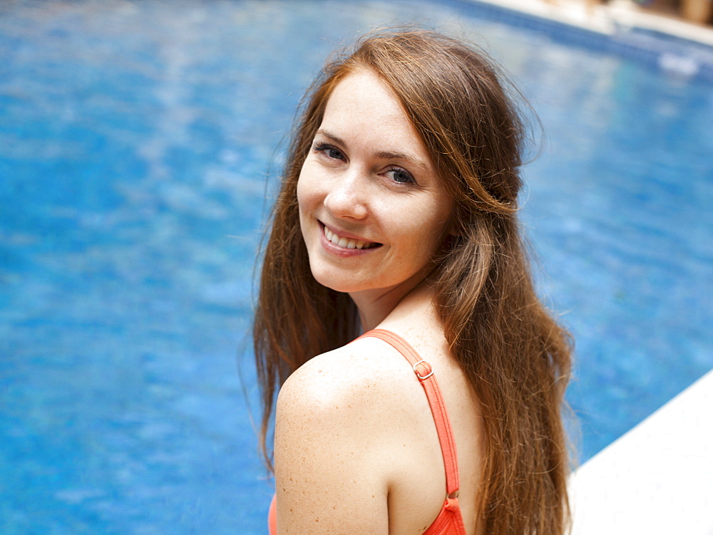 Portrait of young woman at swimming pool, USA, Utah, Salt Lake