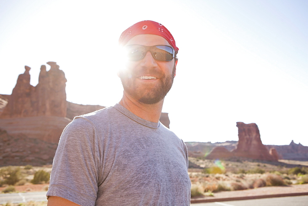 USA, Utah, Moab, Mid adult man posing in cycling gear, USA, Utah, Moab