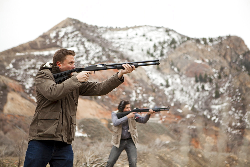 Men in mountains shooting