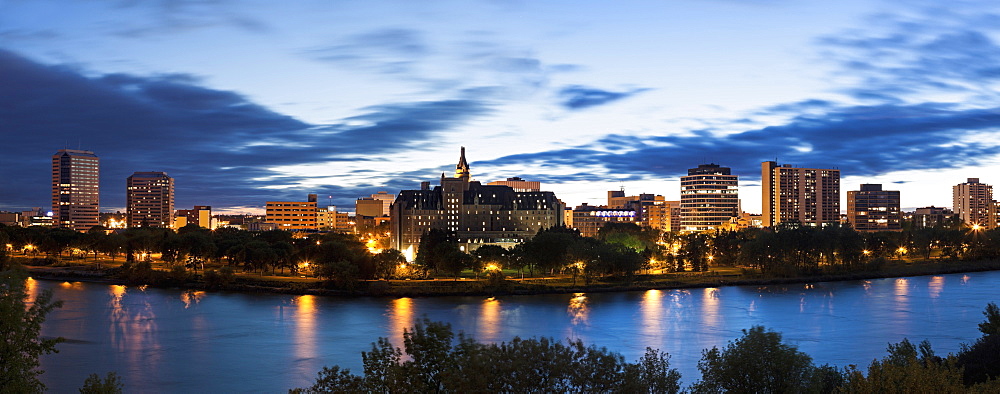 Panoramic view of city and river at dusk, Canada