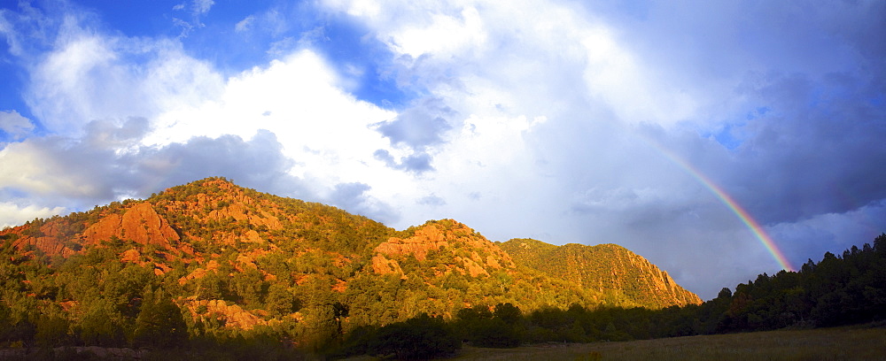 Rainbow over mountain range, USA, Western USA, Colorado