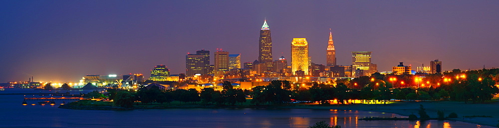USA, Ohio, Cleveland, City skyline illuminated at dusk