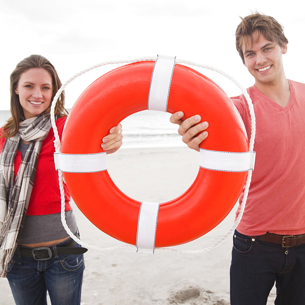 Couple holding life ring