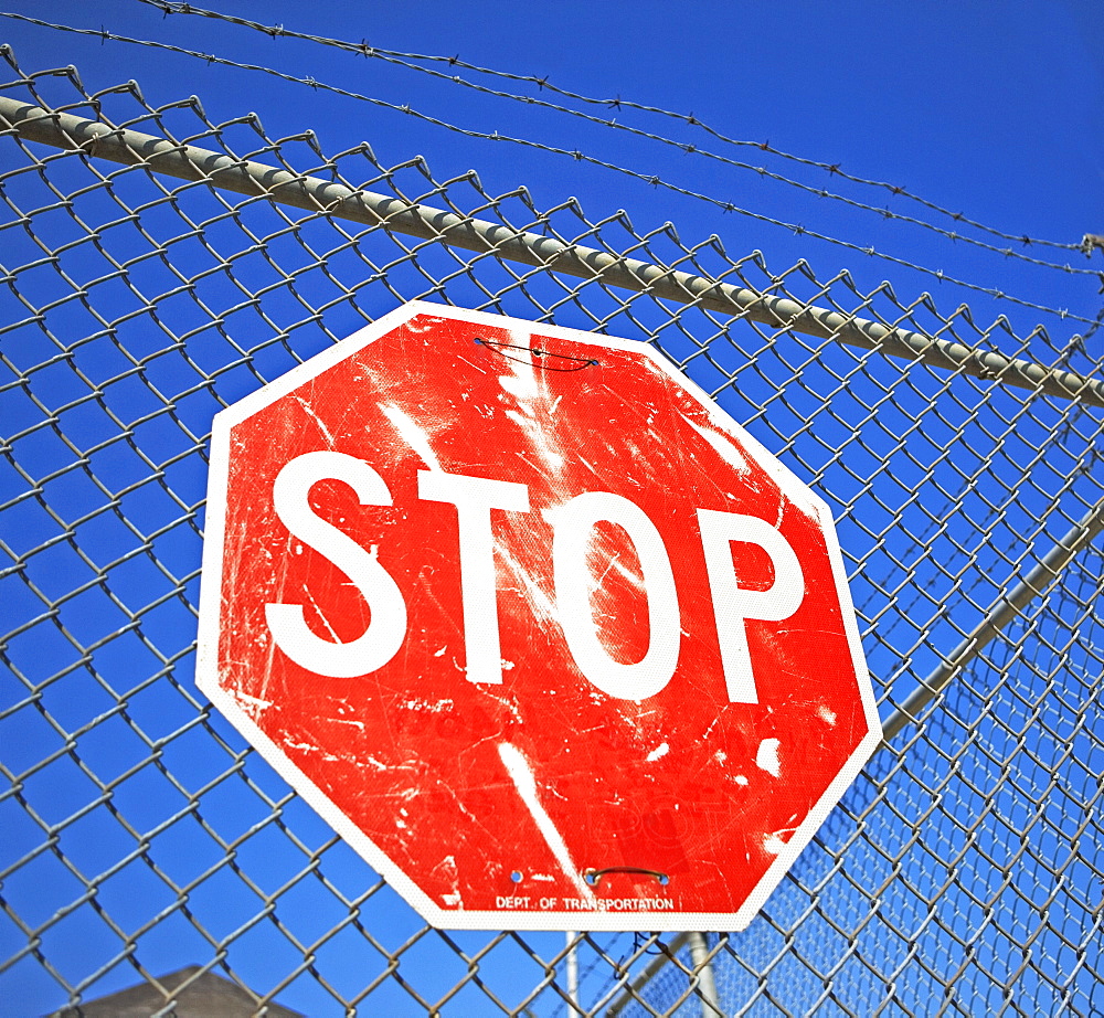 Stop sign on fence