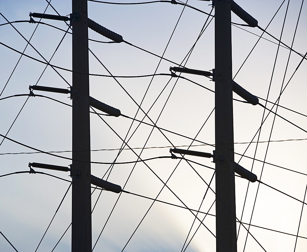 Low angle view of power lines on poles