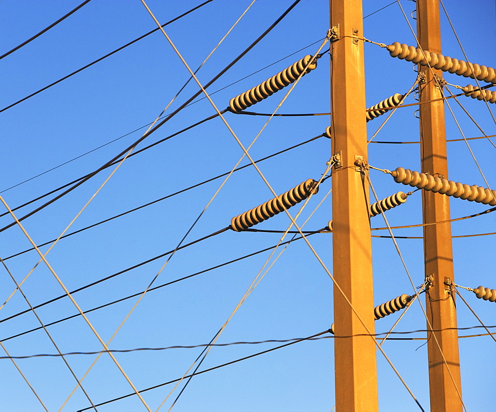 Low angle view of power lines on poles