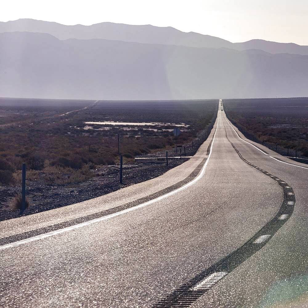 USA, Nevada, Hawthorne, Highway crossing desert landscape