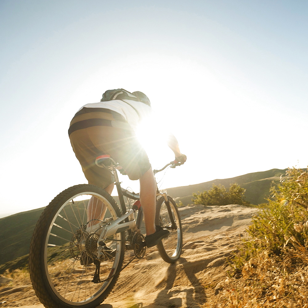 USA, California, Laguna Beach, Mountain biker riding downhill