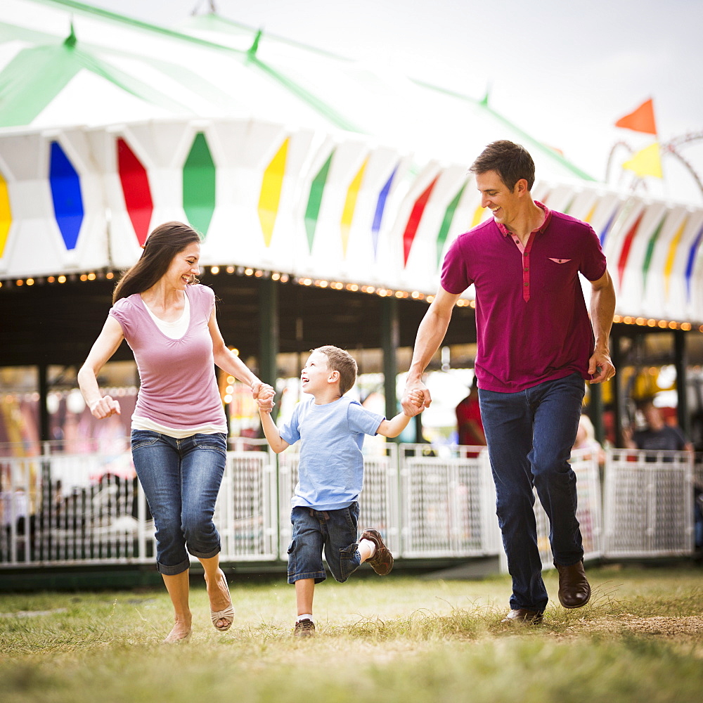 Happy Family and son (4-5) in amusement park, USA, Utah, Salt Lake City 