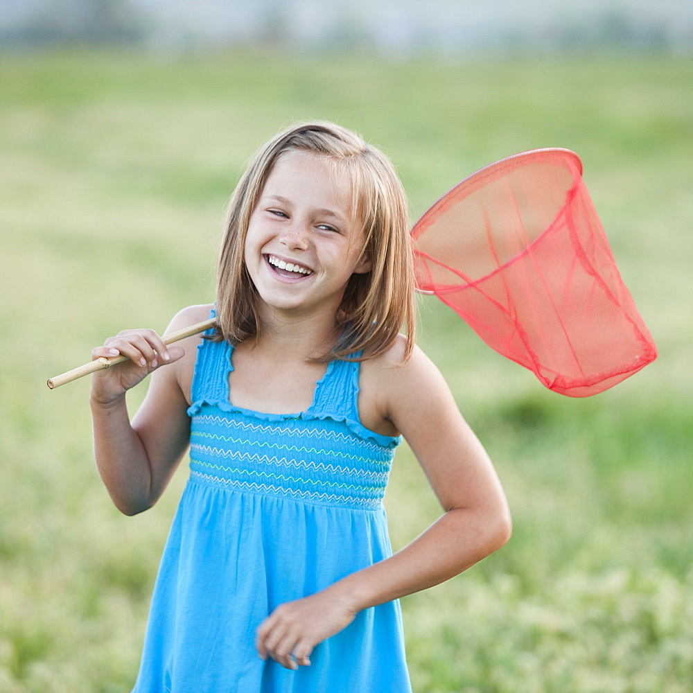 Young girl holding a butterfly net