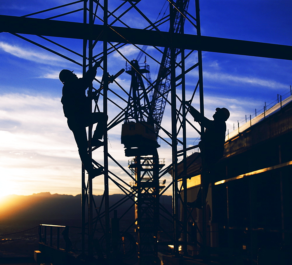 Workers climbing towers of construction site in Las Vegas