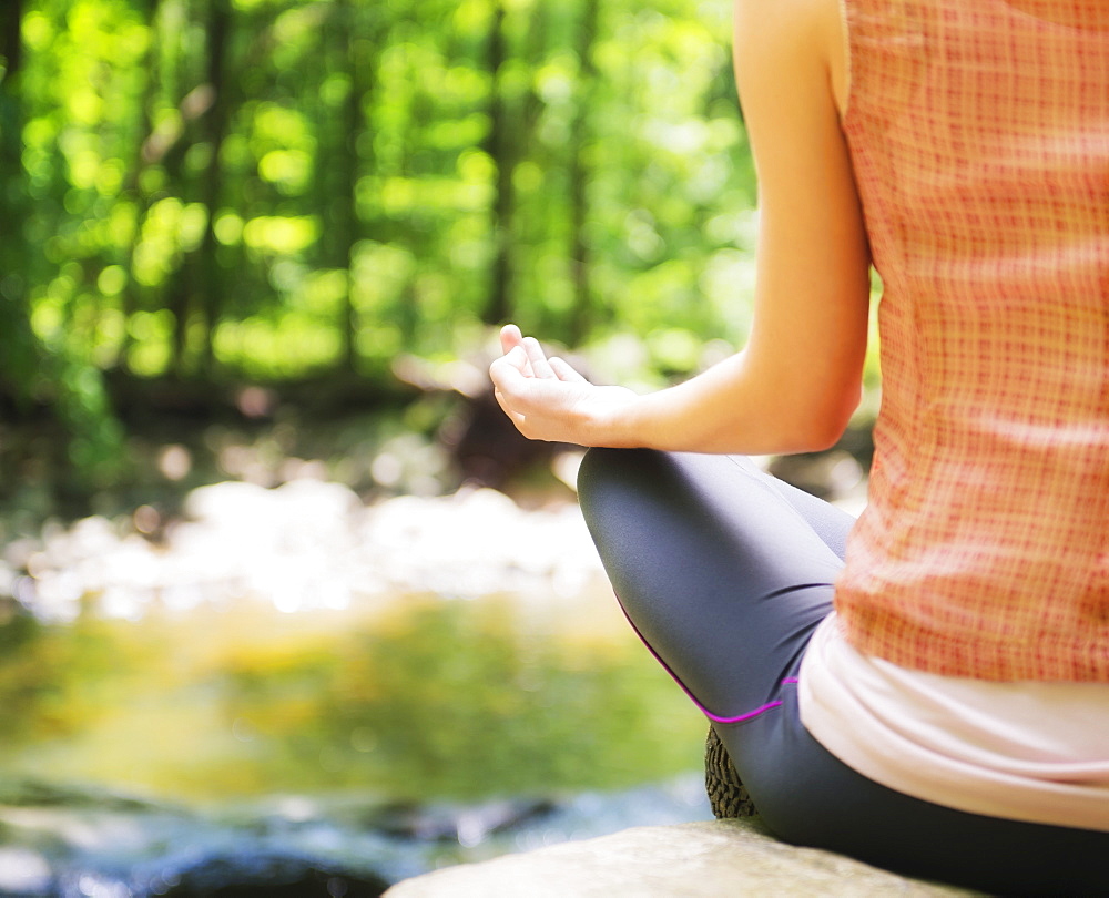 Woman practicing joga in forest, USA, New Jersey, Mendham