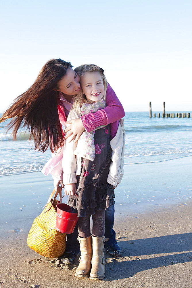 Netherlands, Zeeland, Haamstede, Mother with daughter on beach, Netherlands, Zeeland, Haamstede