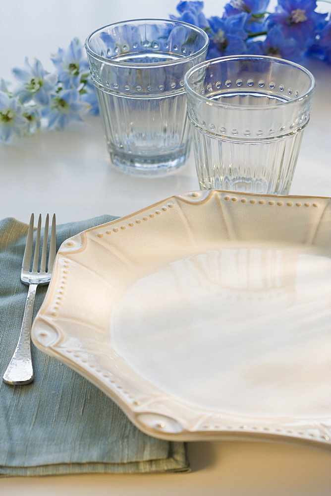 Tropical flowers and placesetting