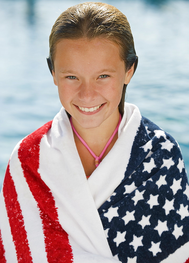 Girl wrapped in American flag towel