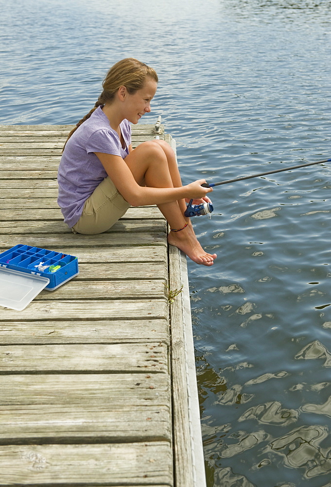 Girl fishing off dock