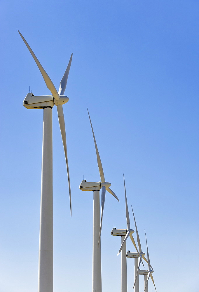 Low angle view of wind turbines