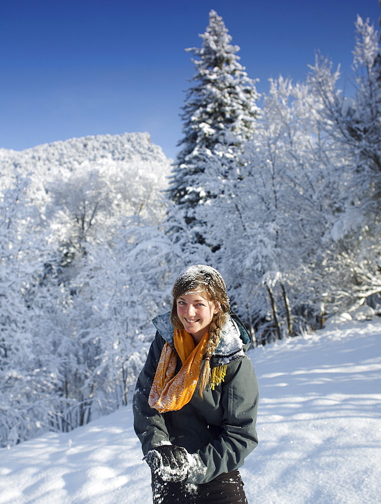 USA, Colorado, portrait of young woman in winter landscape