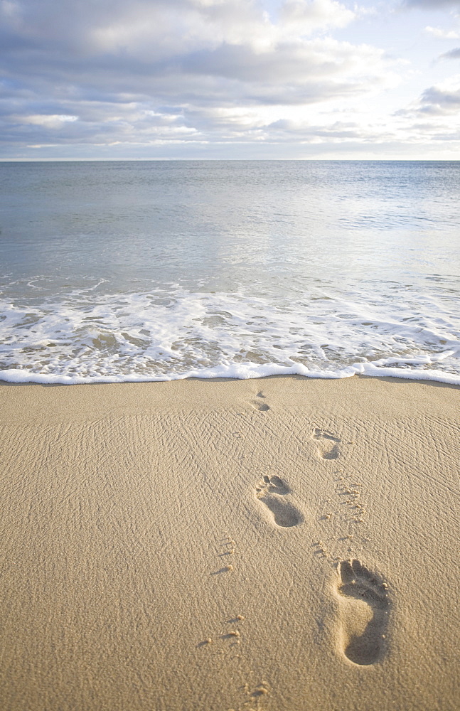 USA, Massachusetts, Cape Cod, footprints on beach at sunset