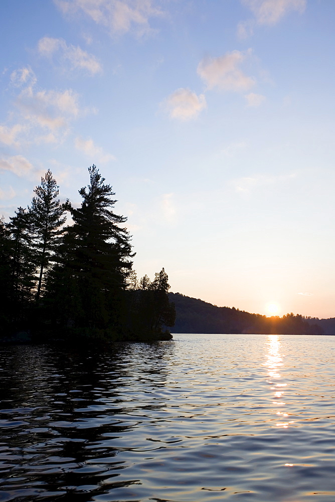 USA, New York State, Adirondack Mountains, Upper Saranac Lake at sunset