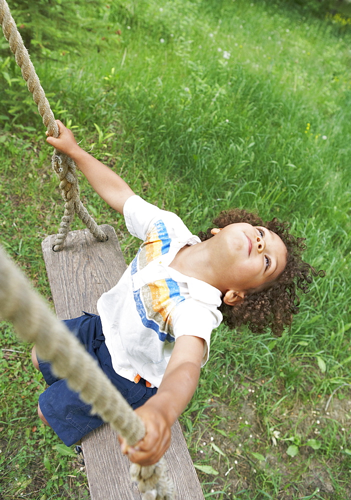 Carefree child swinging