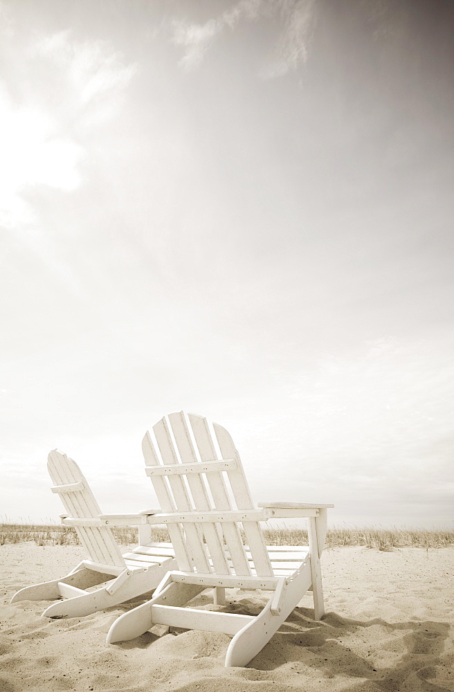 Adirondack chairs on the beach