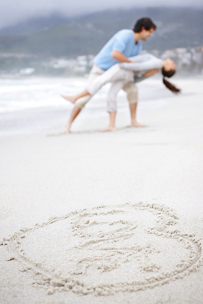 Playful couple at the beach