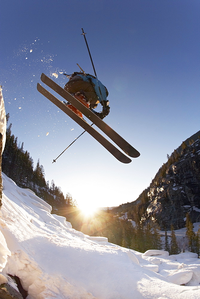 Skier mid jump in Aspen Colorado