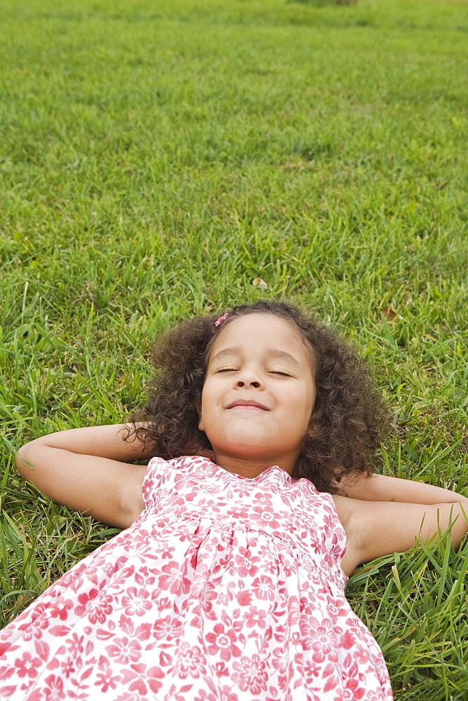 Girl lying on grass