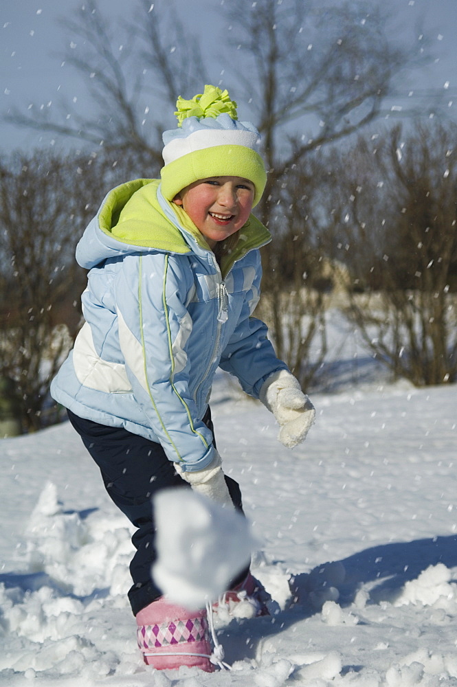 Girl throwing snowball