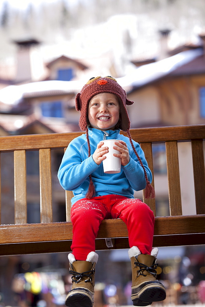 USA, Colorado, Telluride, Boy (4-5) enjoying hot chocolate