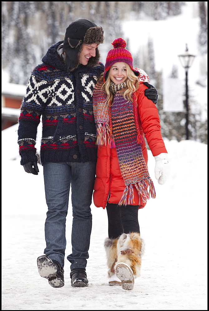 USA, Utah, Salt Lake City, couple walking in snowy village