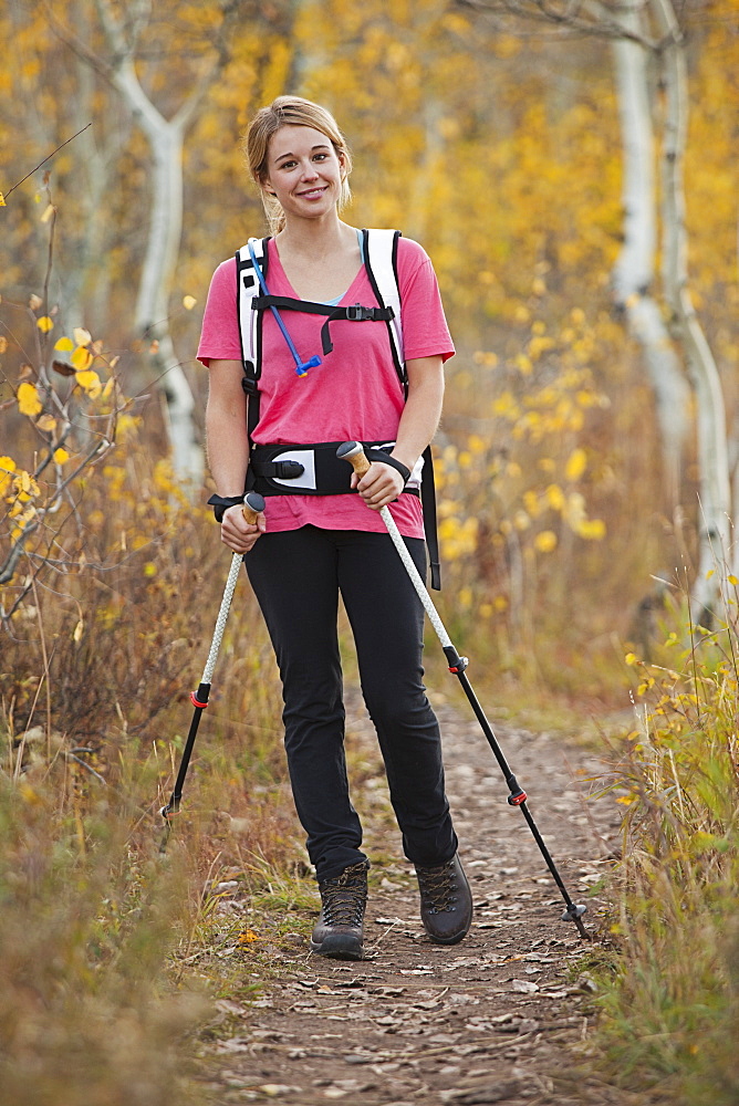 USA, Utah, young woman walking on trail