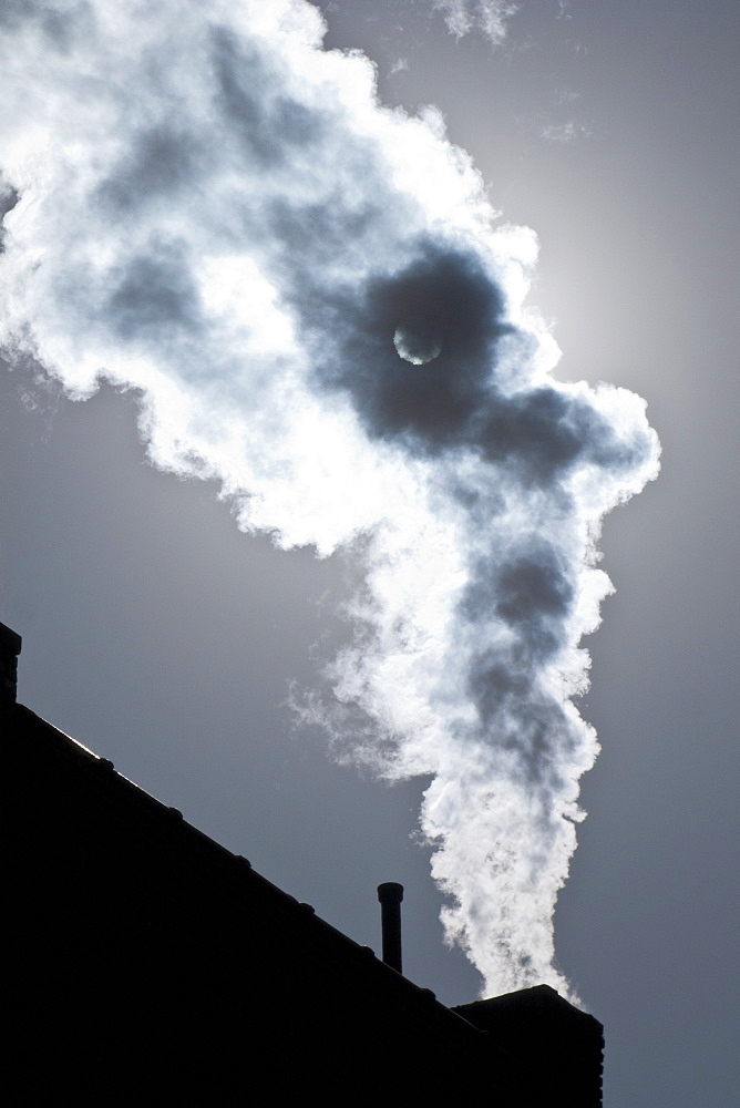 Smoke coming out of factory chimney