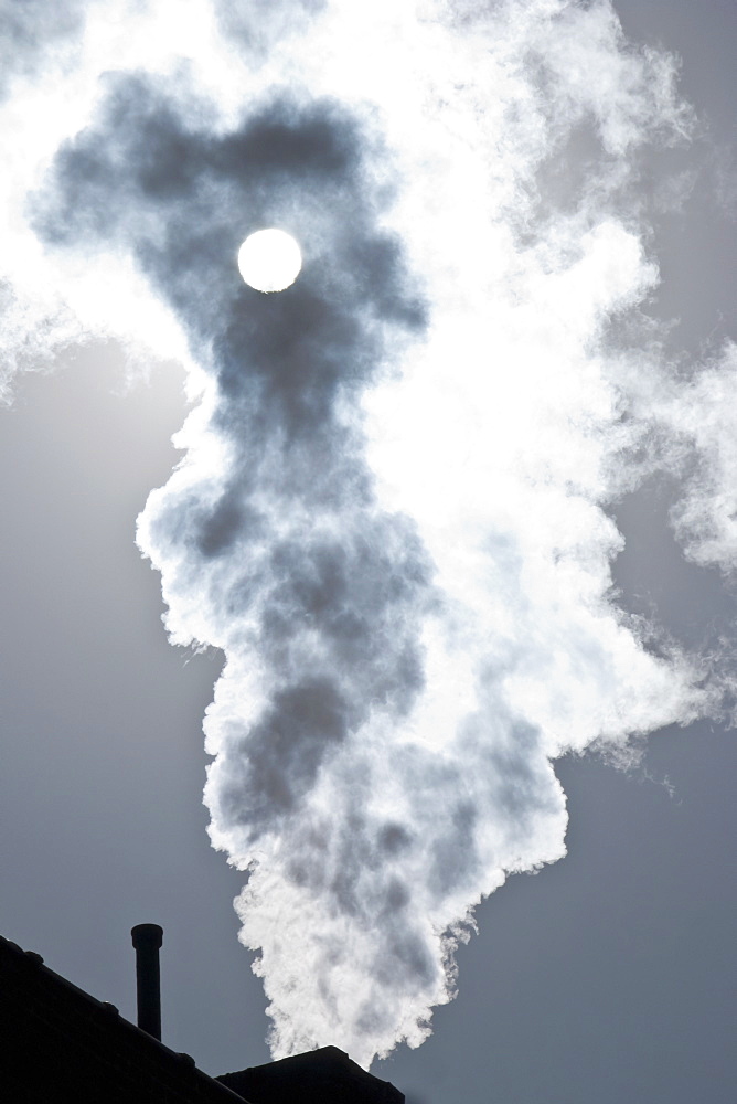 Smoke coming out of factory chimney